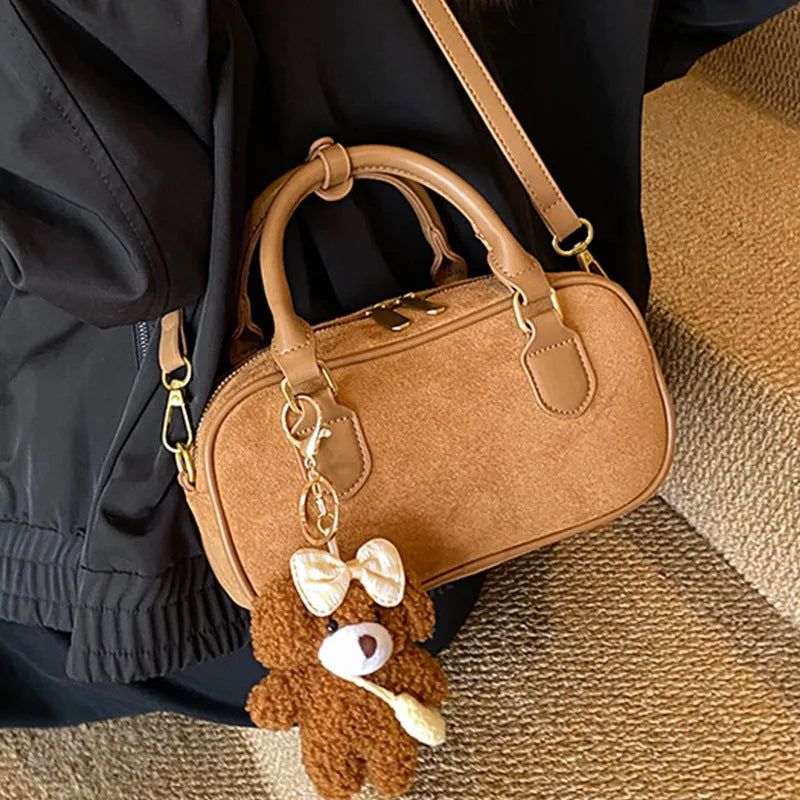 PU bowling bag in black, brown, coffee or green with optional pendant, horizontal square shape and single strap.