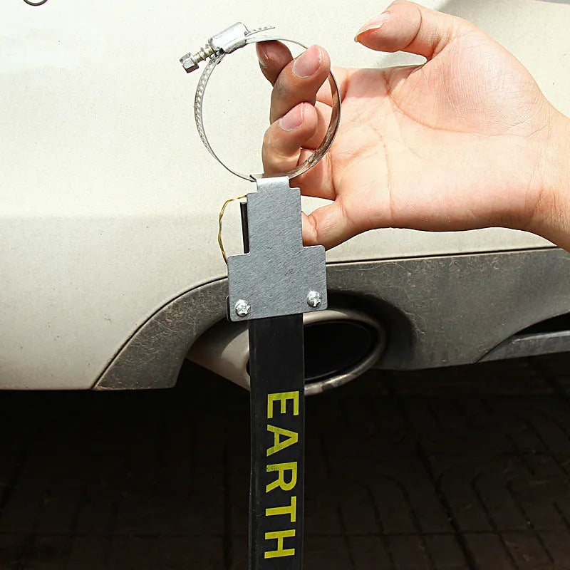 Black car electrostatic grounding belt, 37cm long with metal hook, shown against a vehicle tyre.