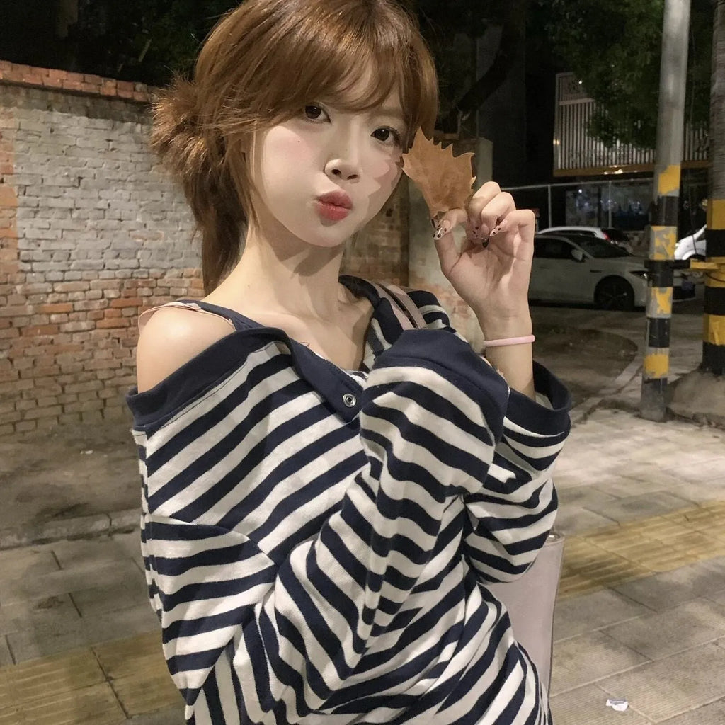 Dark blue Korean-style oversized women's long-sleeved T-shirt with embroidery and stripe details.