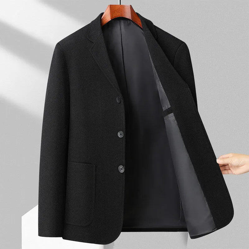 Men's loose-fit woolen suit coat in a solid colour, shown for casual spring or autumn wear.