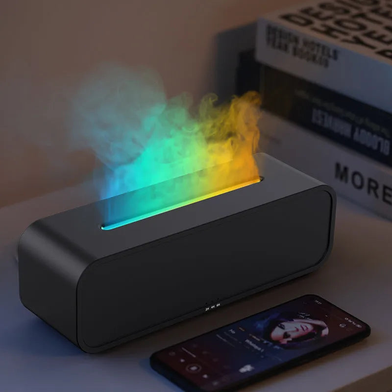 Black Flame Dynamic Aroma Diffuser with LED flame light display and remote control on a desk.