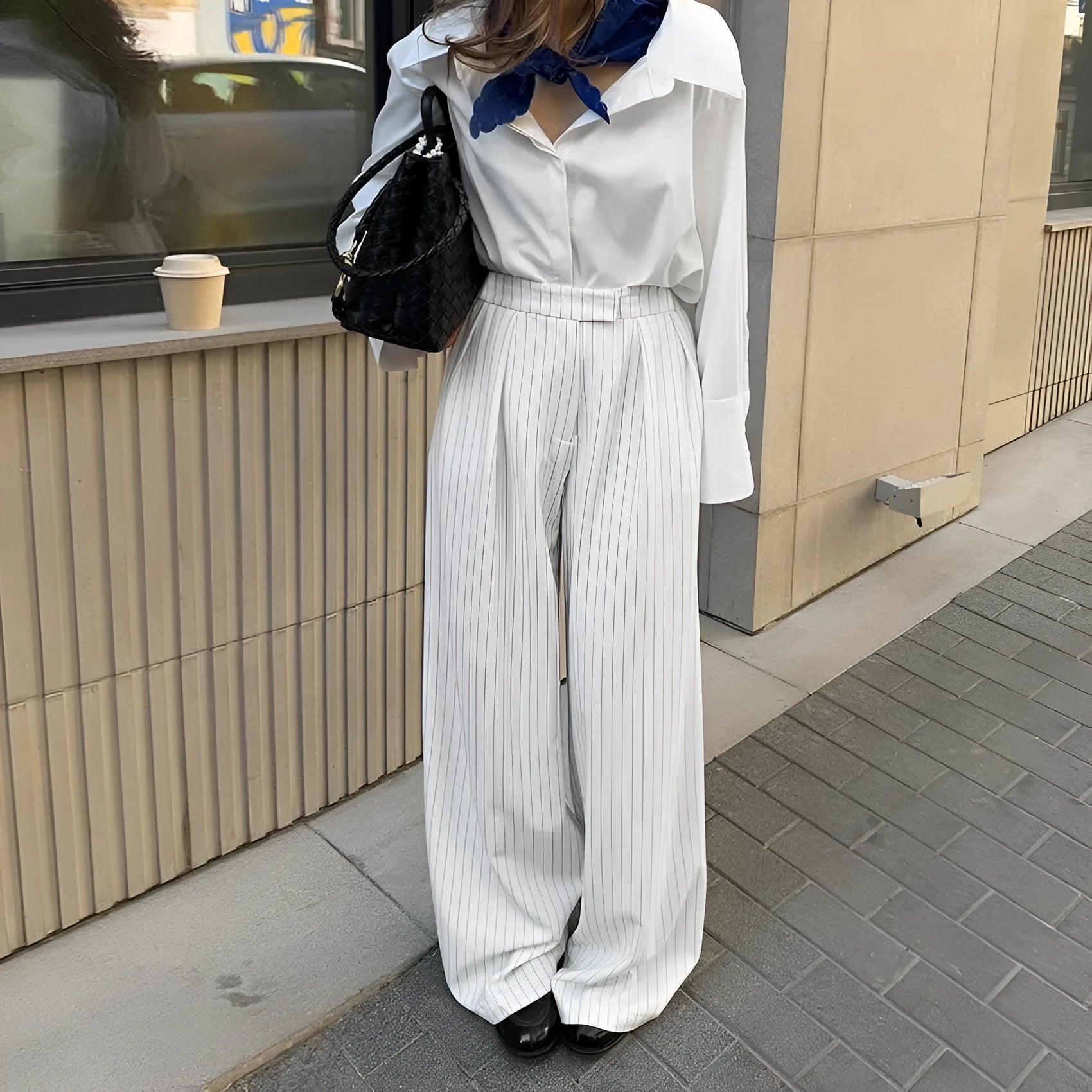 White striped wide-leg trousers with zipper detailing on loose casual silhouette