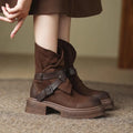 Brown retro British style women's ankle boots with mid-heel platform, buckle closure, round toe, and rubber sole