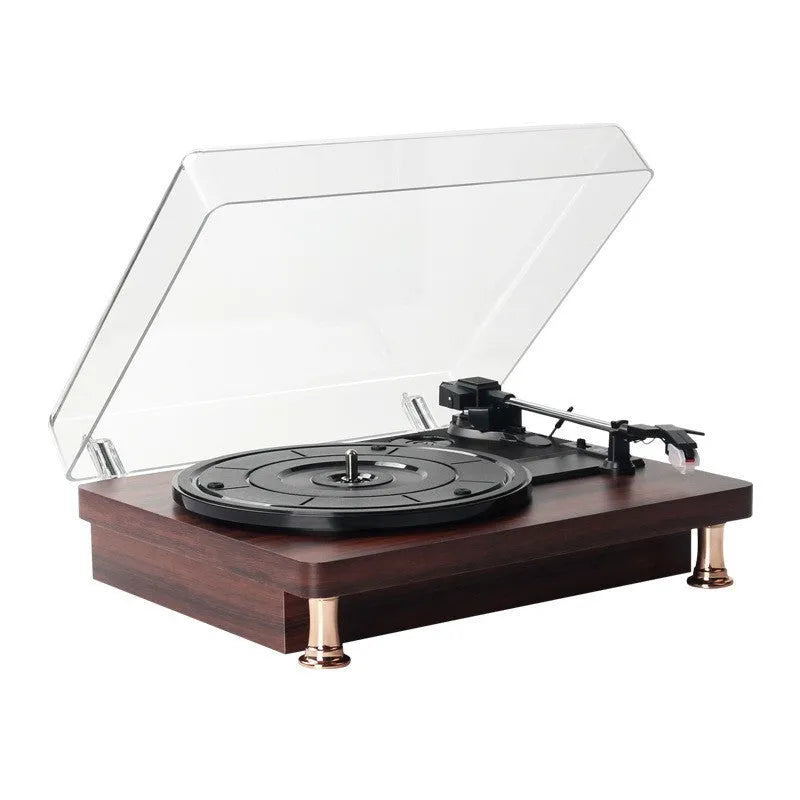 Retro vinyl record player with wood grain finish, transparent dust cover, and built-in speaker