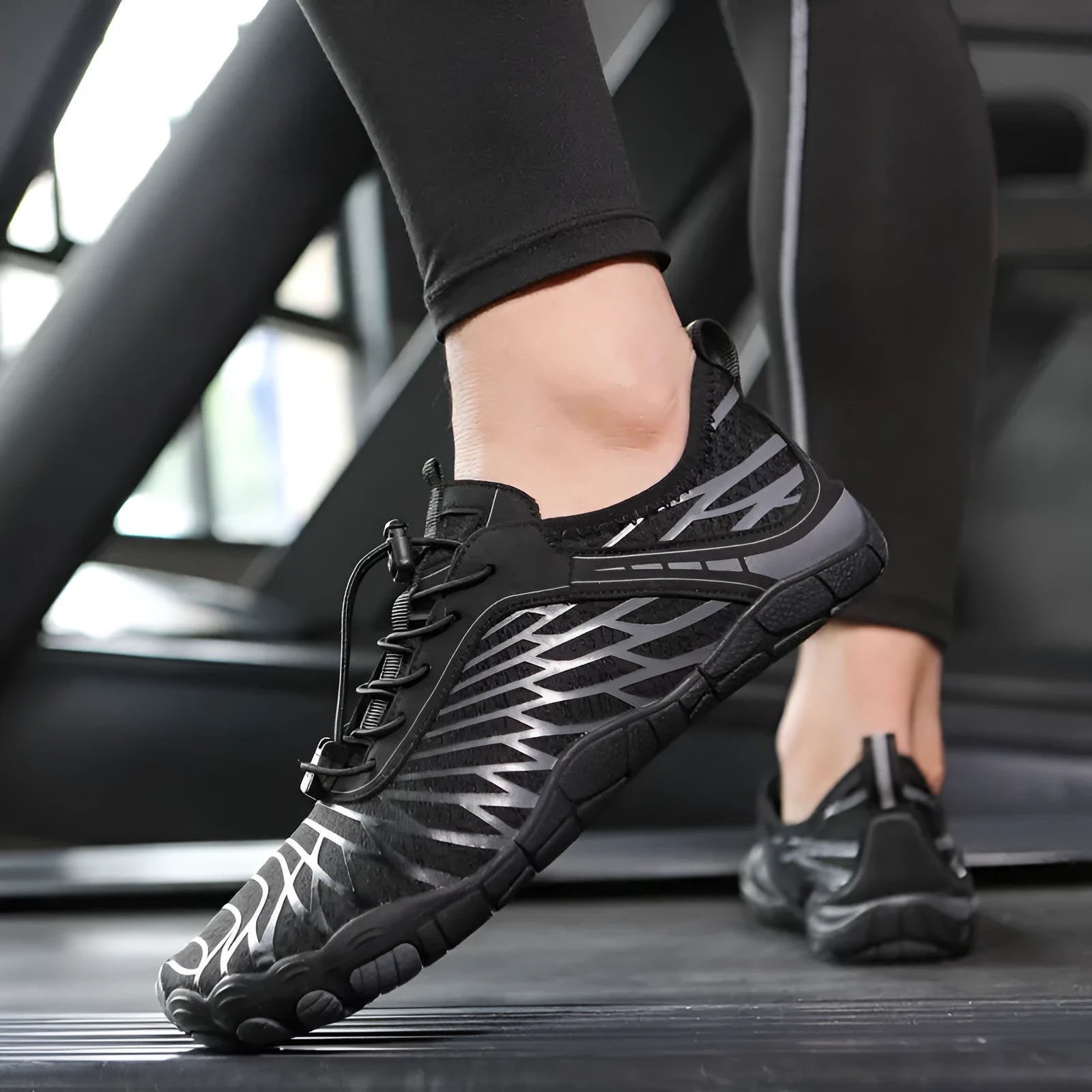 White and pink lace-up upstream sports shoes with a rubber sole on a neutral background.