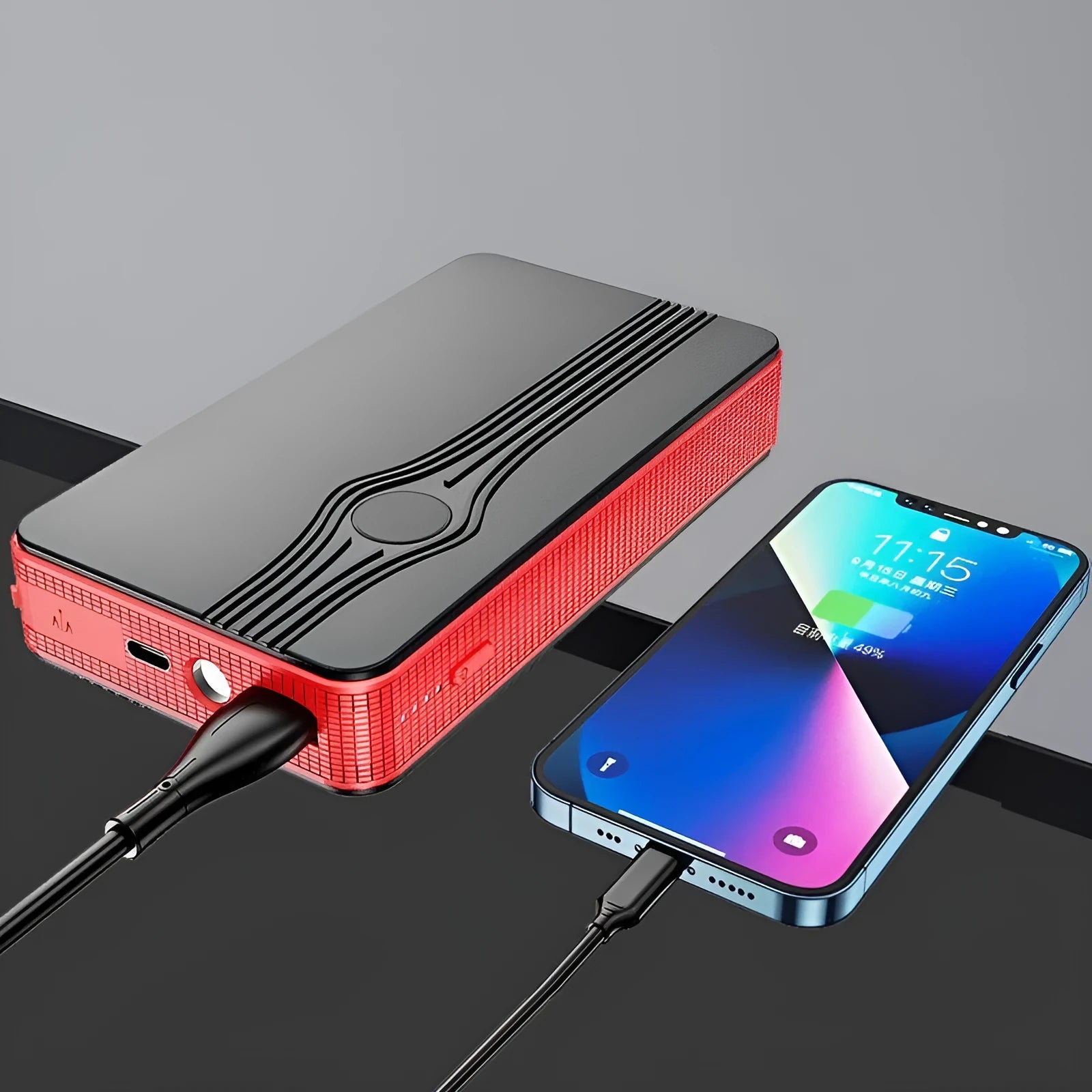 Red K4-E automotive emergency jump starter and power bank unit with charging cable.