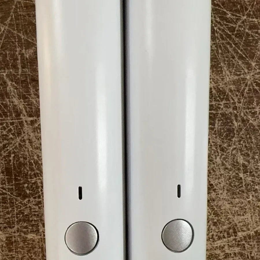 USB electric vacuum sealer pump with reusable food storage envelope bags on a kitchen counter
