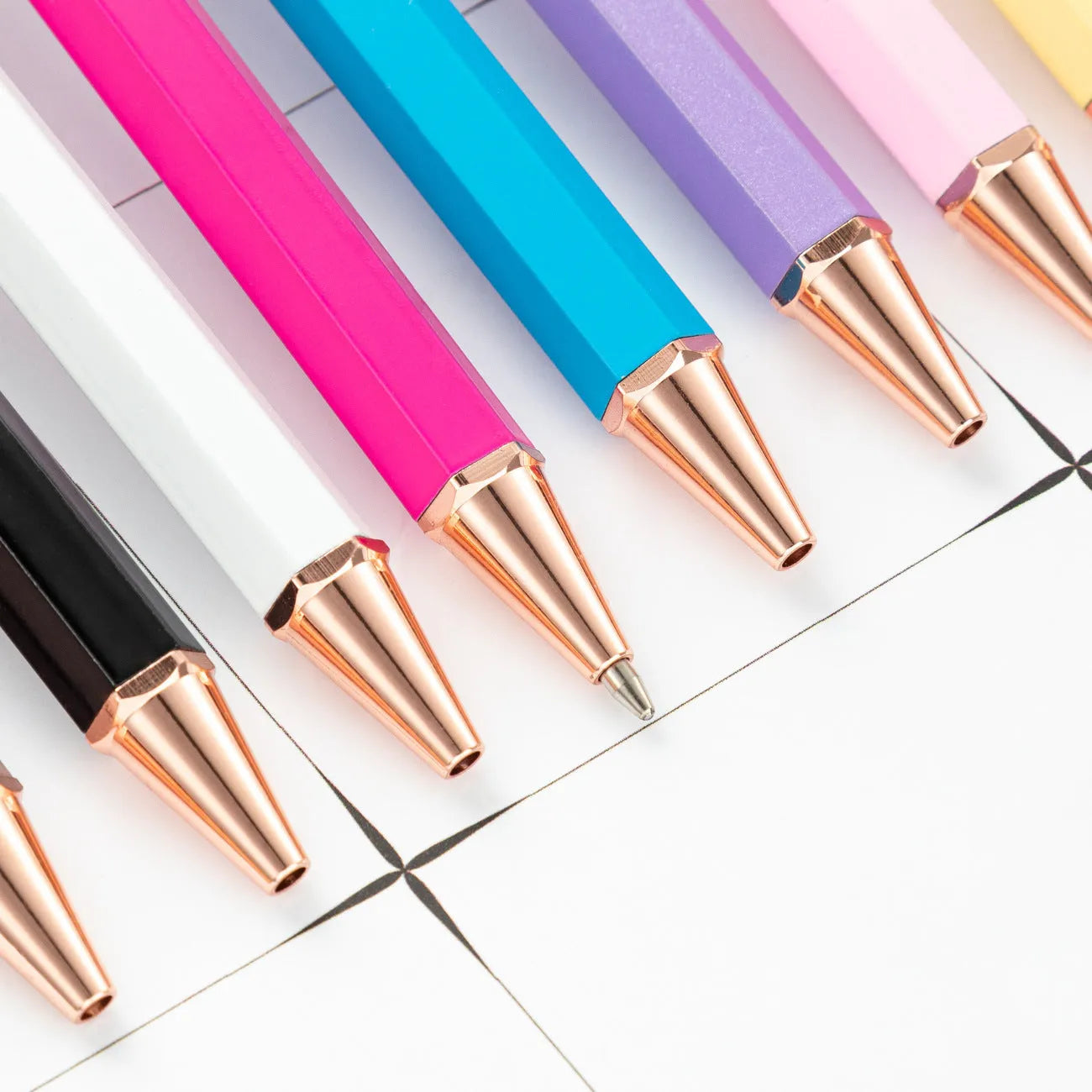 Metal six-angle ballpoint pen in black with 1.0mm bullet tip on white surface