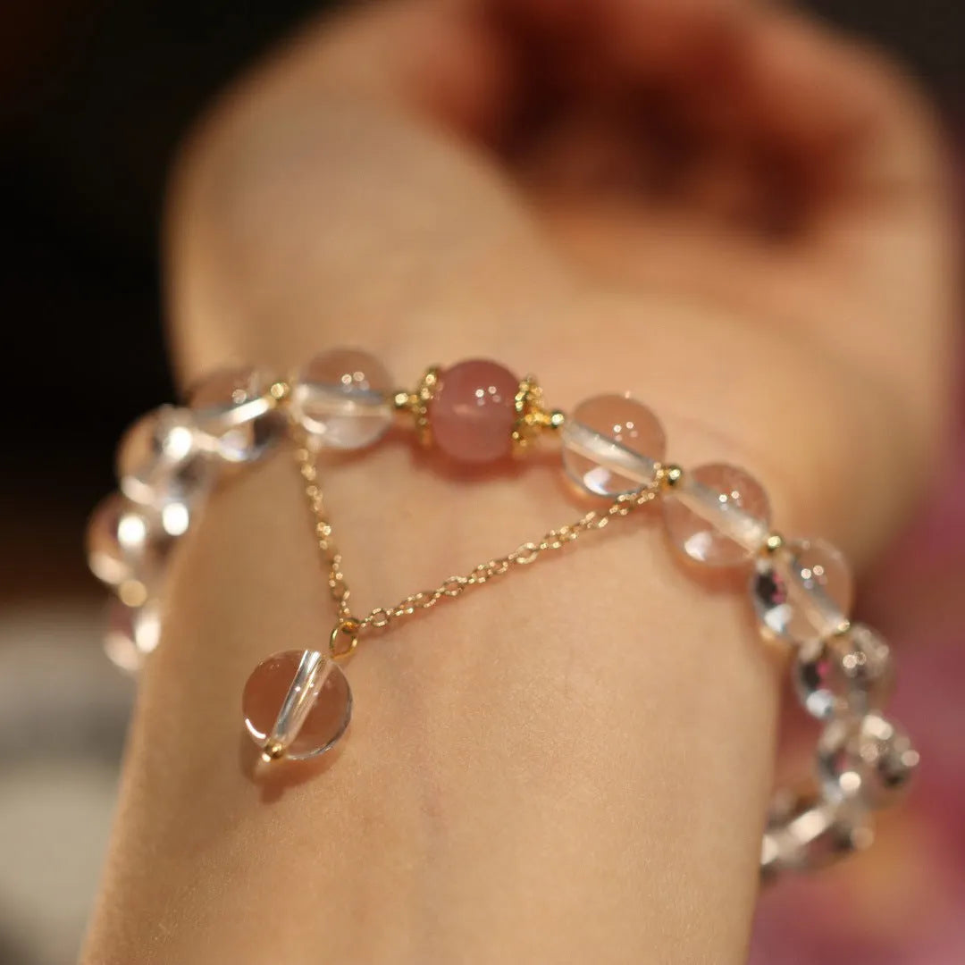 White and pink crystal bracelet with geometric Chinese design and cat eye obsidian elements