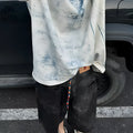 Loose fit solid colour T-shirt with short sleeves and a round neck on a hanger.