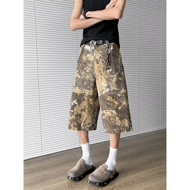 Yellow cotton jeans with a detailed snake pattern and camouflage print, featuring a cropped leg length.