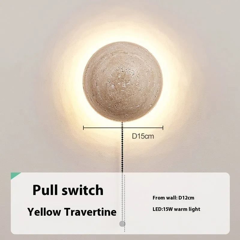 Vintage semicircle wall lamp with a yellow cave stone shade and iron base, showing the pull switch.