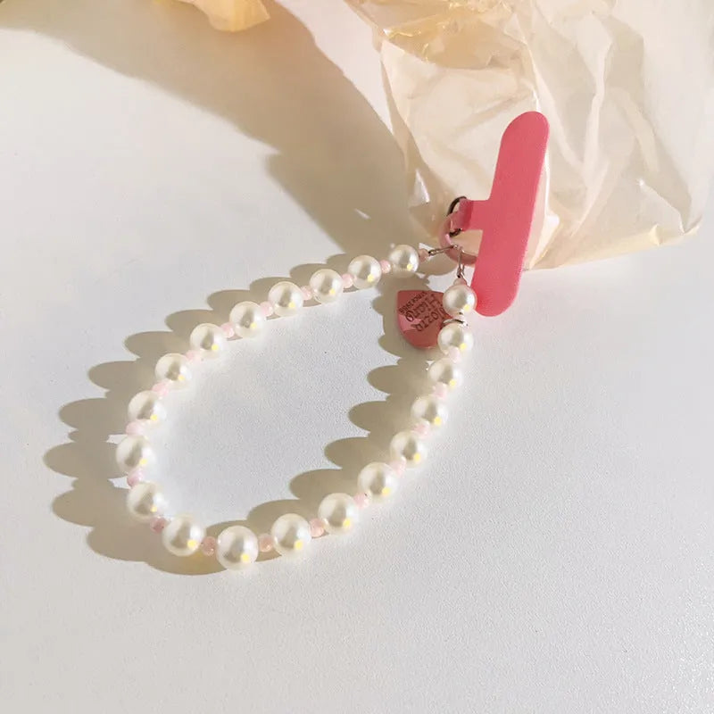 Pink pearl beaded mobile phone lanyard with crossbody long shoelace and short rope wrist strap options, small pink clip.