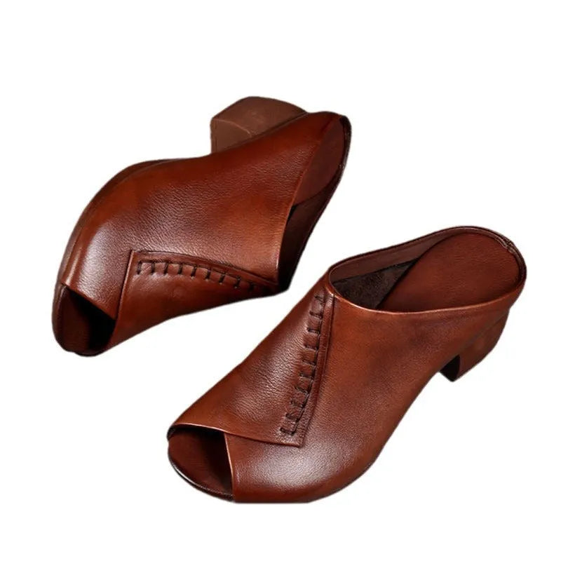 Women's black peep-toe slipper with a square heel and fish mouth opening, shown on a white background.