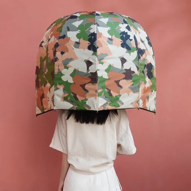 Long-handled helmet umbrella open showing 76cm diameter canopy in a vinyl-laminated fabric design.