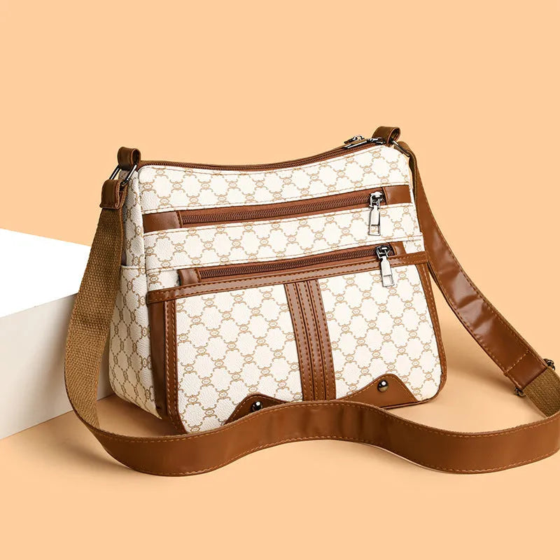 Women's brown and white stitching pattern large-capacity crossbody bag with PU exterior.