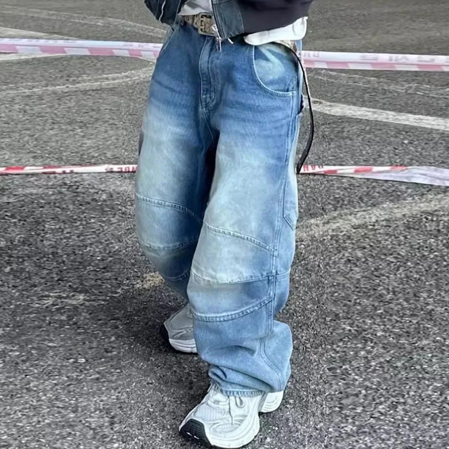Men's washed light blue baggy jeans with a straight-leg cut and zip fly.