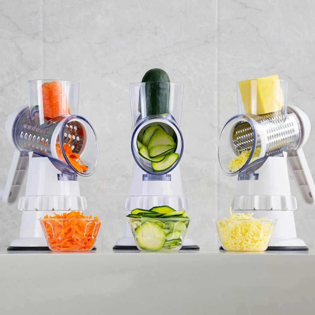 White 3-in-1 manual vegetable slicer with stainless steel blades on kitchen counter