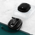 White and black power bank with integrated wall plug showing compact square design