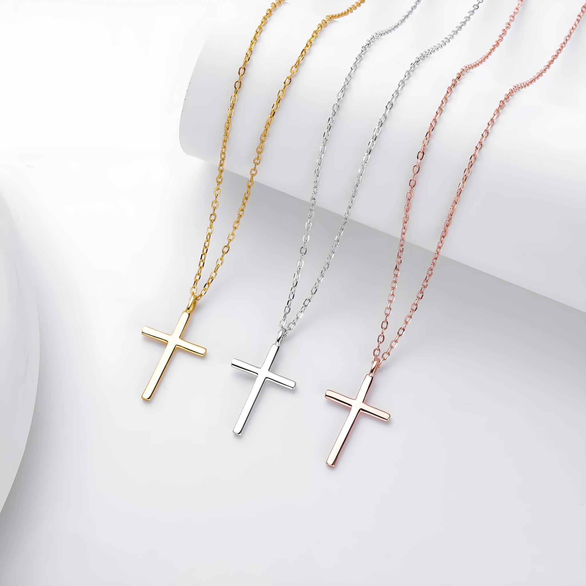 S925 sterling silver necklace with a simple glossy cross pendant on an O-shaped clavicle chain.