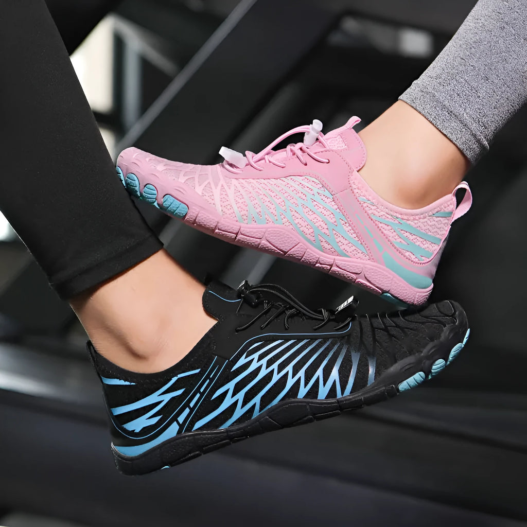 Low-top white outdoor sports shoes with lace-up front and textured rubber sole.