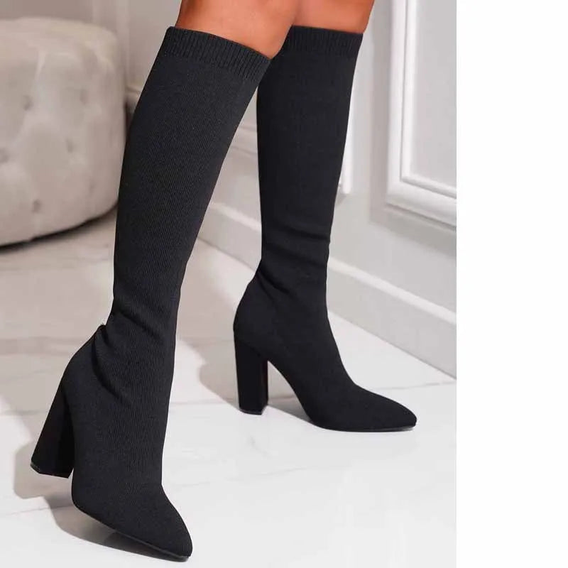 Women's thick high-heel thigh boots in solid black colour with PU upper and super high heel above 8cm