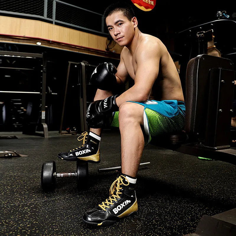 Mixed combat training high-top wrestling shoes in green, with mesh and leather upper and rubber sole.