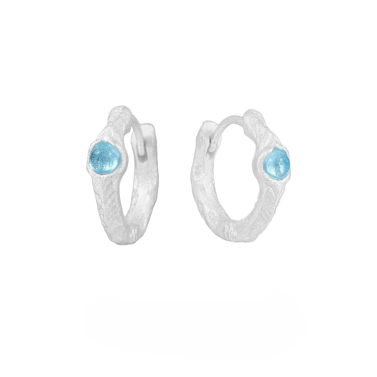Female geometry round ear clip in burnt silver finish made from 925 silver