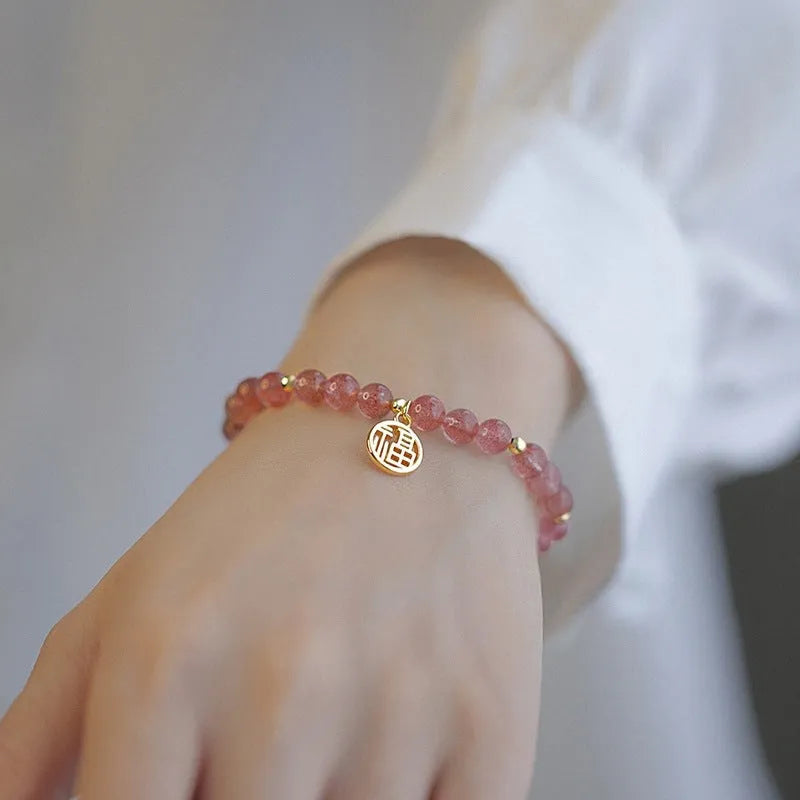 Handmade strawberry quartz blessing card bracelet with glass construction and adjustable universal wrist size