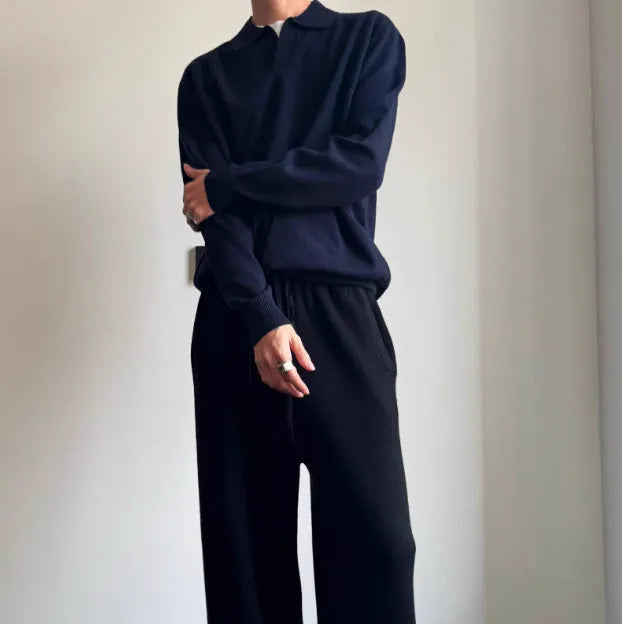 Man wearing a milky white pure wool polo sweater with a lapel collar and loose fit.