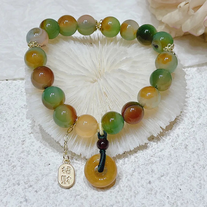 Women's peacock agate and topaz bracelet with a traditional peace buckle clasp.