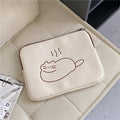 Embroidered cat design on a navy blue nylon tablet protective sleeve with a black zipper.