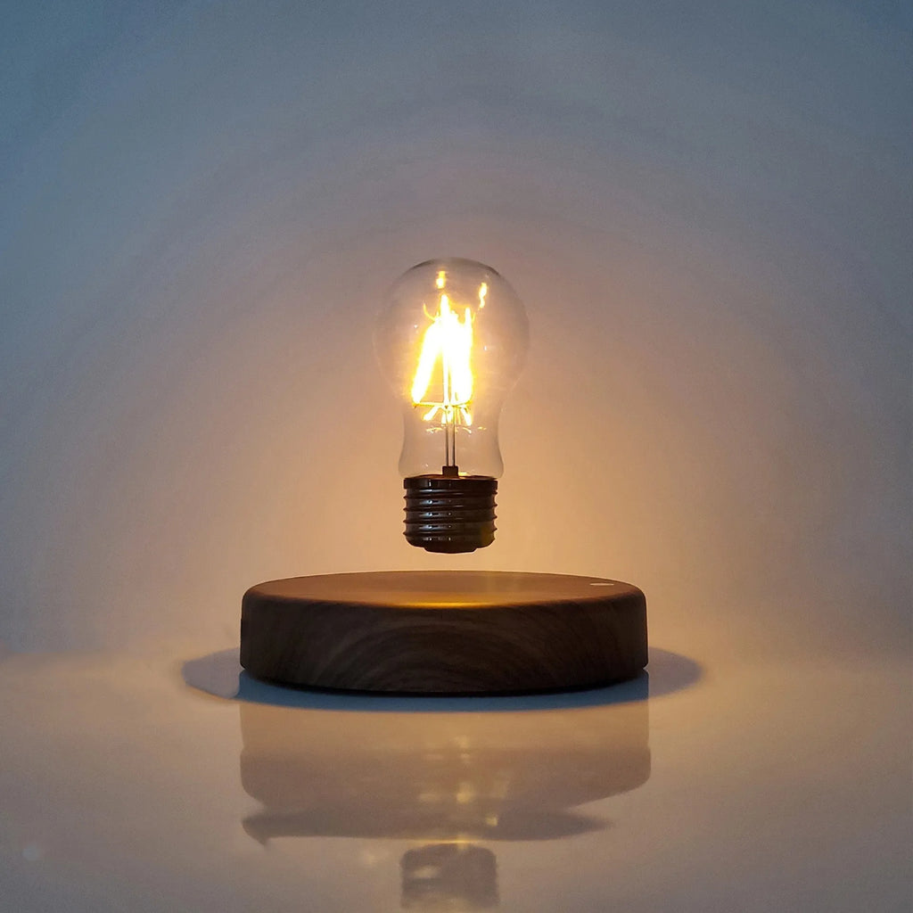 Magnetic levitation bulb night light floating above wooden base