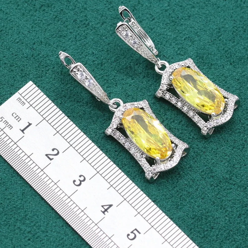 Anti-allergy alloy zircon jewellery set showing necklace, earrings, ring and bracelet in yellow or olive colours