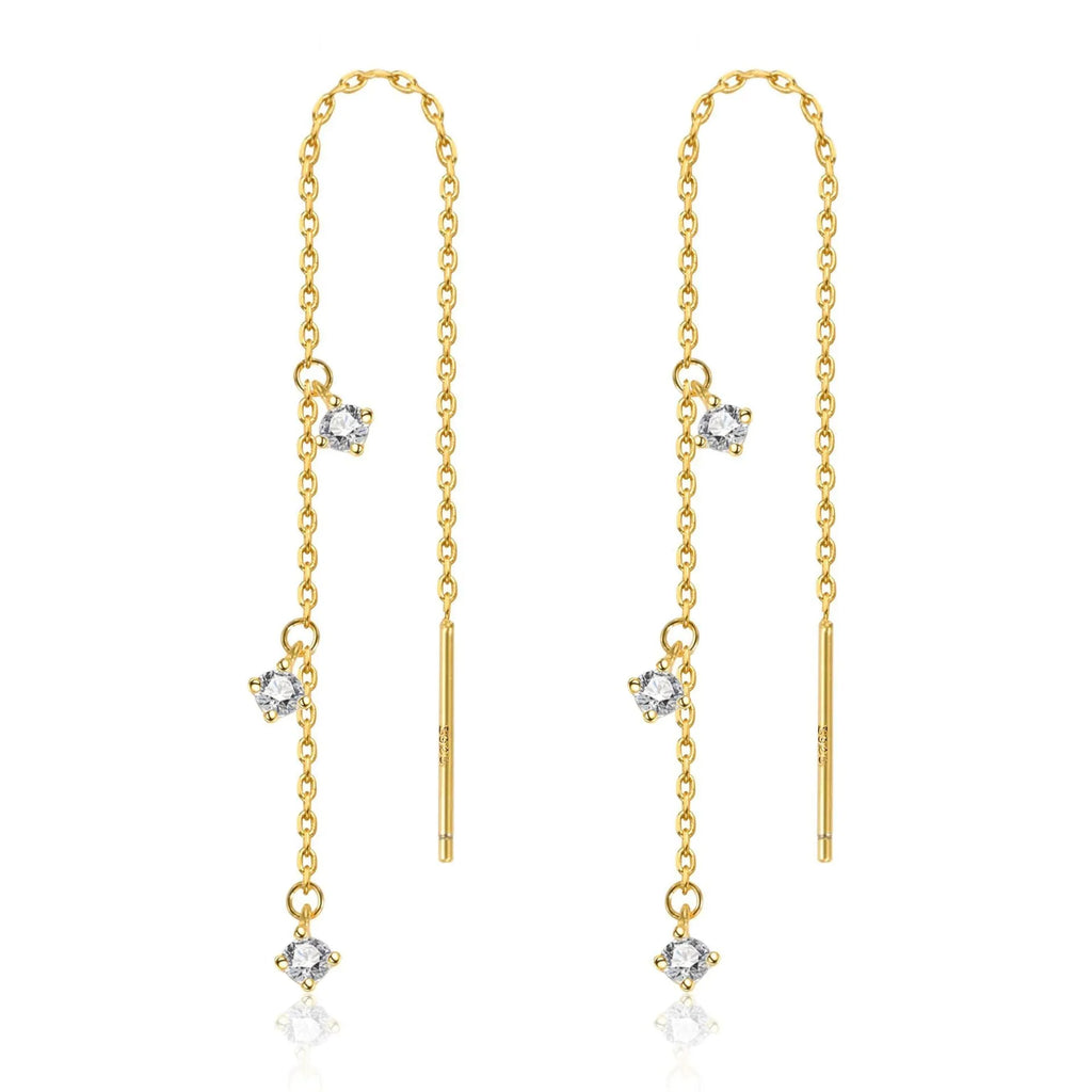 Gold pair of copper geometric round earrings with small zircon stone and ear hook closure on neutral background