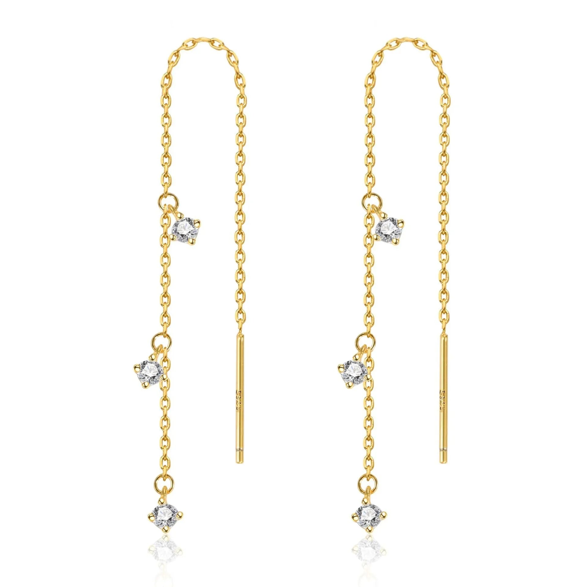 Gold pair of copper geometric round earrings with small zircon stone and ear hook closure on neutral background