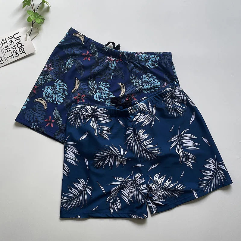 Men's loose fit anti-embarrassment swimming trunks in dark blue background large flower pattern, polyester fabric