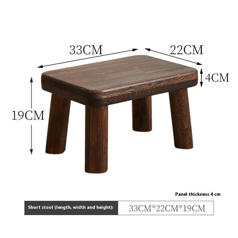 Solid wood distressed finish shoe changing stool with bracket legs.