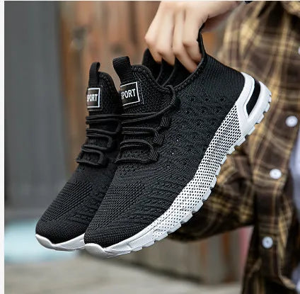 Men's solid colour casual shoes with mesh upper in light grey.