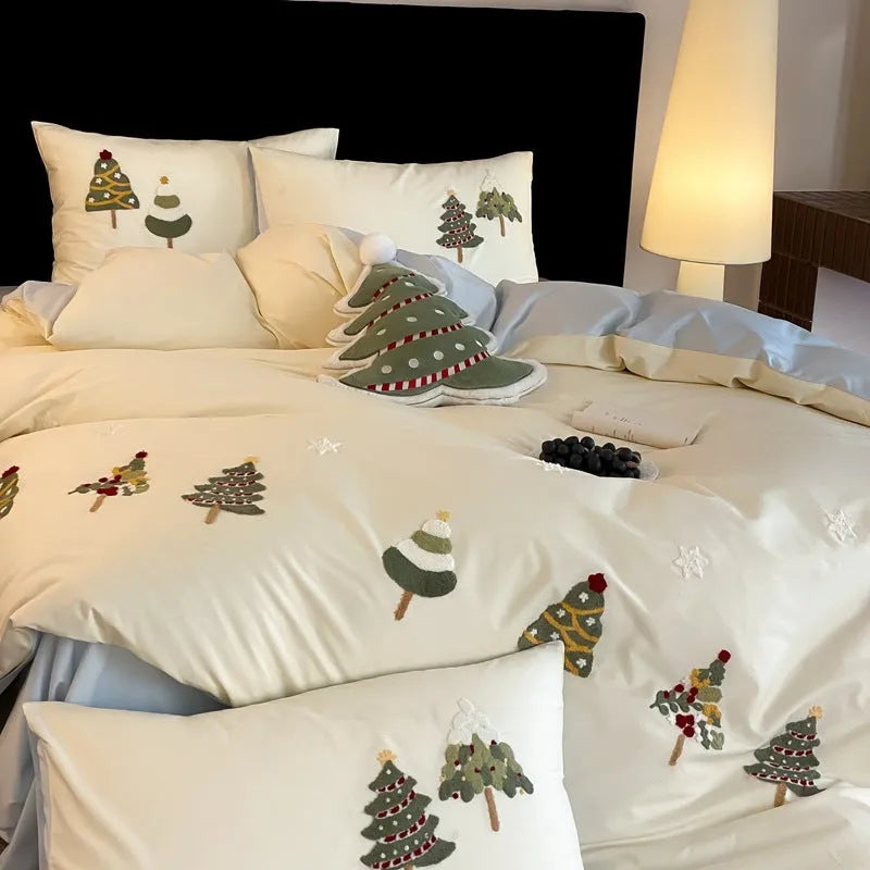 Pure cotton duvet cover and pillowcase set with raised embroidered Christmas tree and floral design in green and cream.