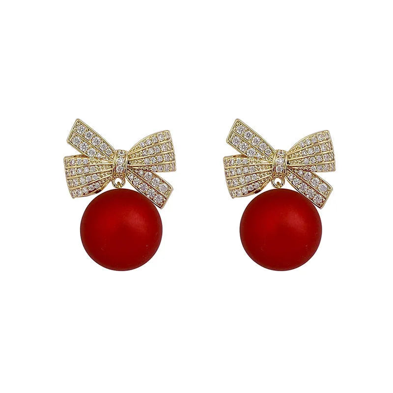 Women's bowknot stud earrings with rhinestone detail in Blue Pink Red White, alloy electroplated, individually packed.