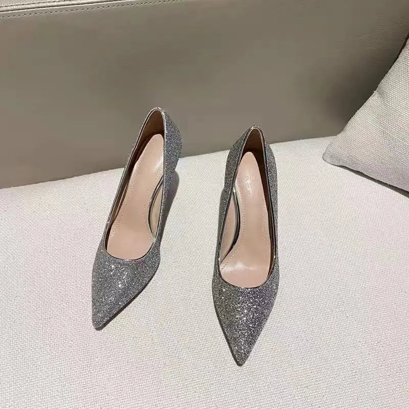 Silver and black women's stiletto bridal shoes with crystal detail on a 9cm heel.