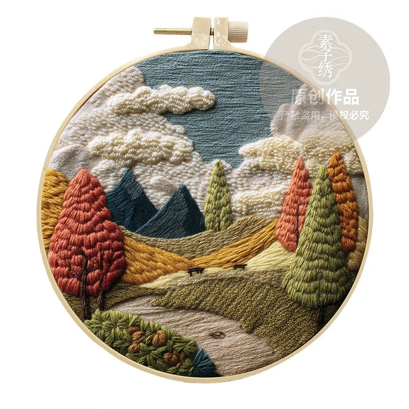 Embroidery DIY kit with landscape-printed cotton fabric, embroidery threads, and needles for handmade cloth art