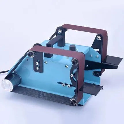 Blue desktop dual-axis belt sander with two sanding heads and a variable speed switch on a workbench.