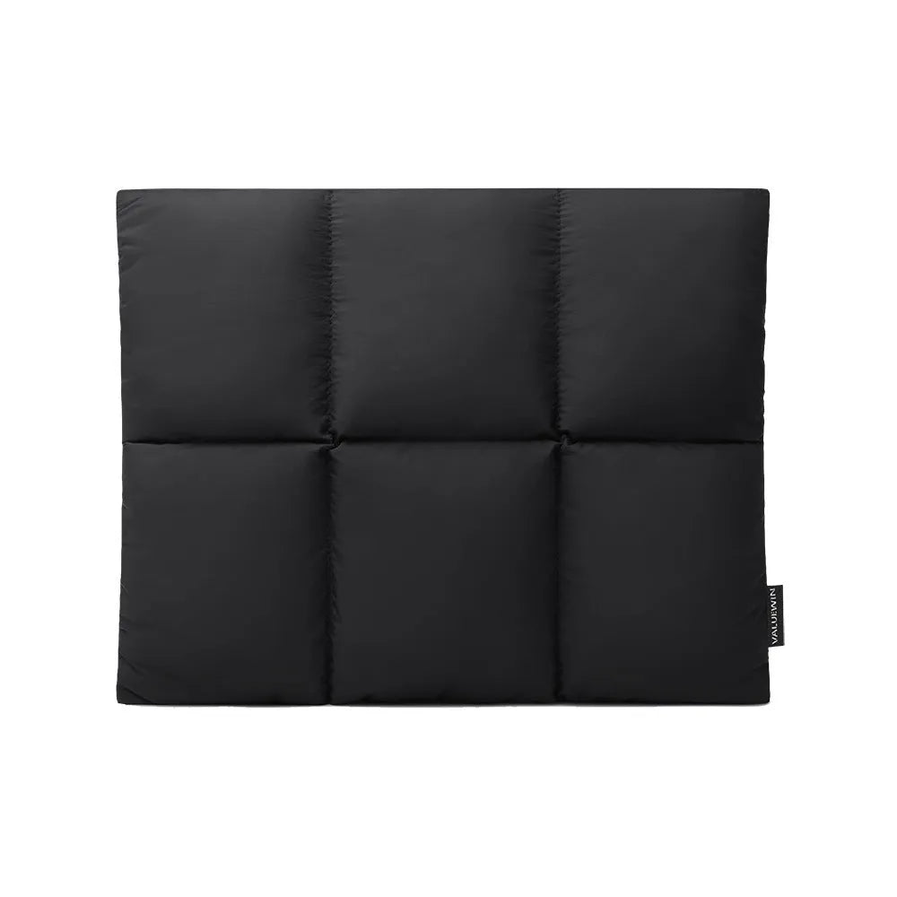 Soft fluffy laptop sleeve in black showing sewing thread details and open to reveal polyester lining