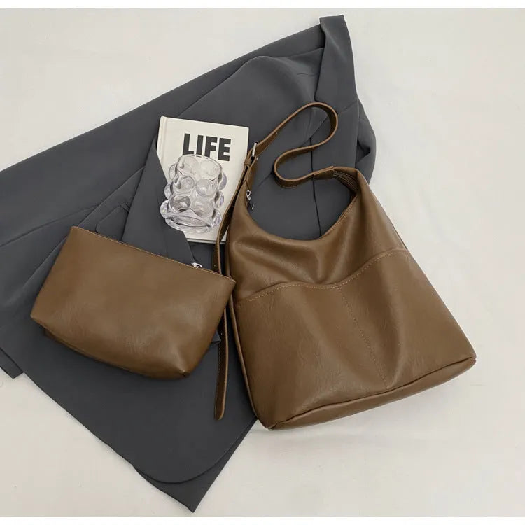 Women's large-capacity soft PVC shoulder bag bucket shape with stitching in beige white colour