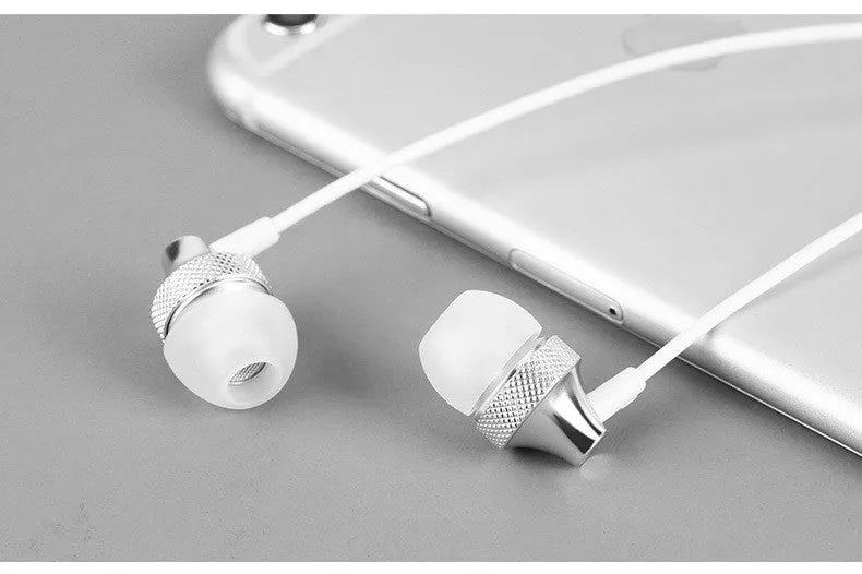 Gold metal in-ear headphones with a black wheat cable and 3.5mm plug on a white background.
