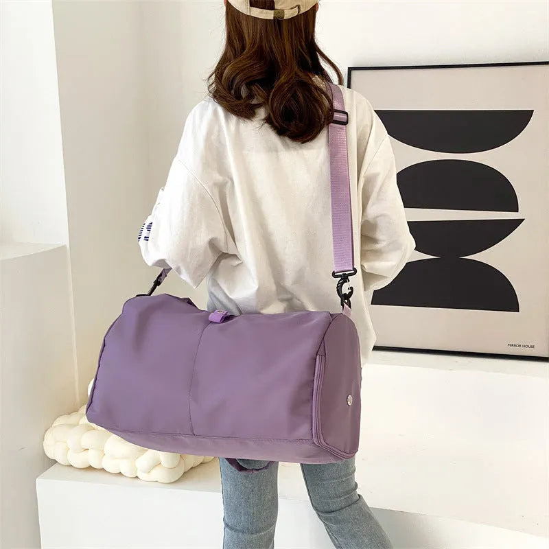 Women's large capacity Oxford cloth yoga bag with dry and wet separation in grey, shown with a yoga mat and laptop inside