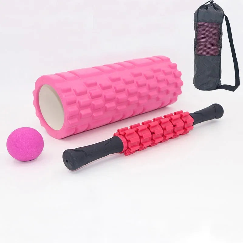 Black 33cm fitness foam roller and massage stick set on a grey background.