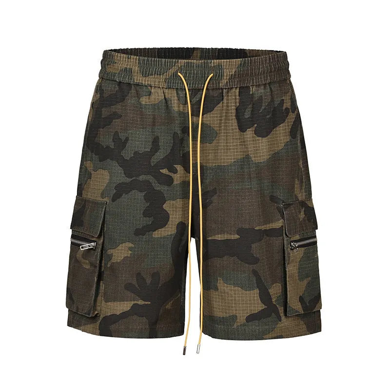 Men's camouflage work shorts with multiple pockets showing cropped length and mid-waist design